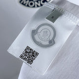 Front view of Moncler luxury clothing with signature branding
