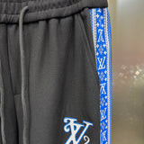 Flat lay presentation of Louis Vuitton luxury clothing with runway-inspired design