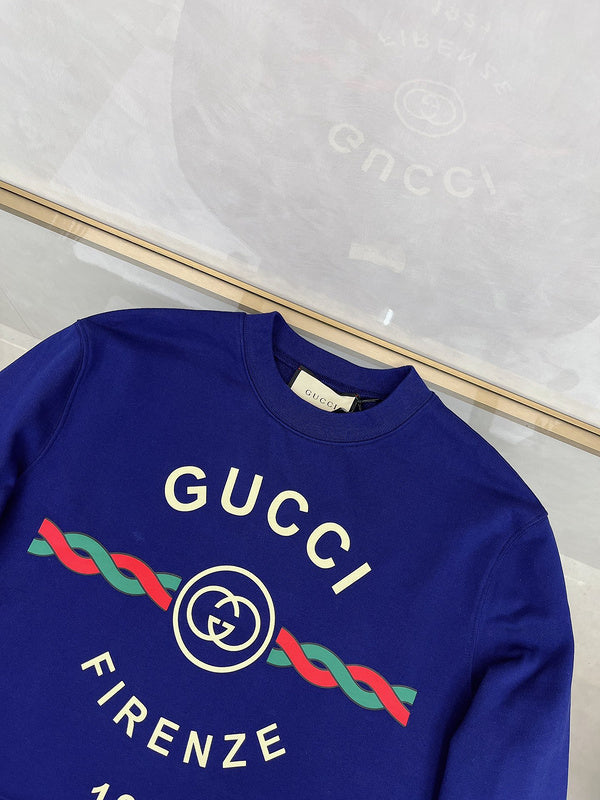 Close-up detail shot of Gucci luxury clothing with logo-detail design