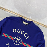 Close-up detail shot of Gucci luxury clothing with logo-detail design