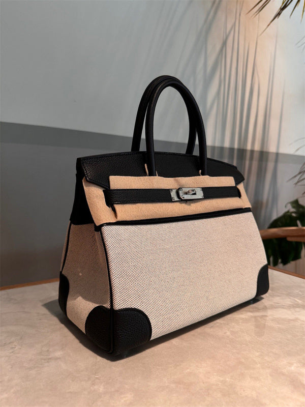 Side view of refined structured handbag