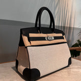 Side view of refined structured handbag