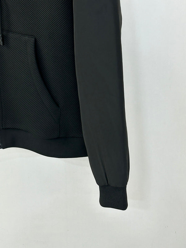 Front view of Louis Vuitton luxury clothing with label-forward styling