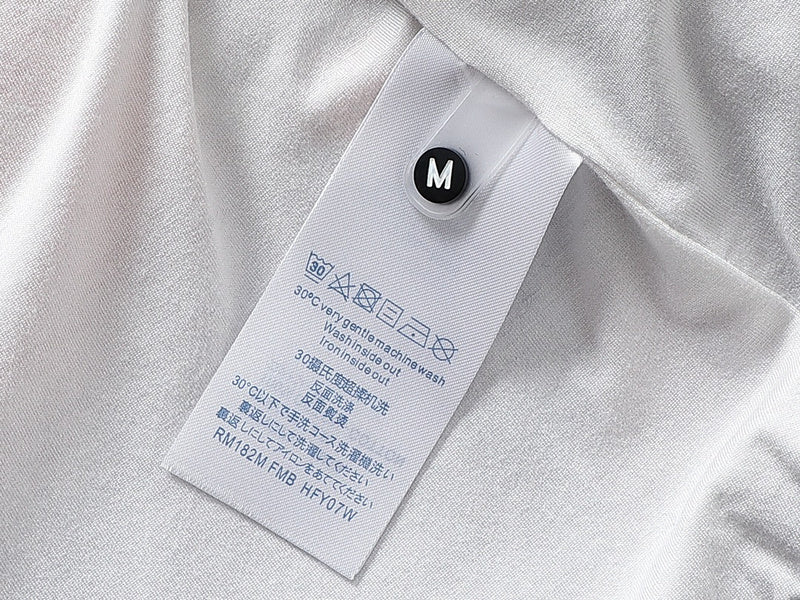 Close-up detail shot of Louis Vuitton luxury clothing with monogram-inspired silhouette