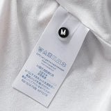 Close-up detail shot of Louis Vuitton luxury clothing with monogram-inspired silhouette