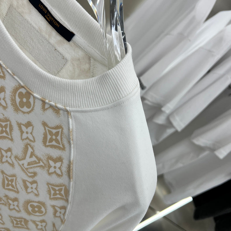 Flat lay presentation of Louis Vuitton luxury clothing with relaxed-fit cut