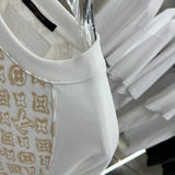 Flat lay presentation of Louis Vuitton luxury clothing with relaxed-fit cut