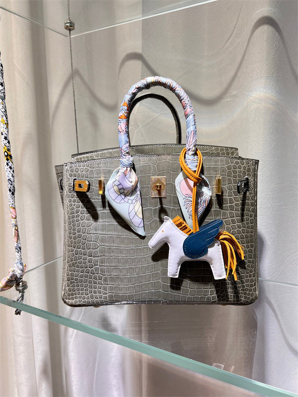 Side view of tailored structured handbag