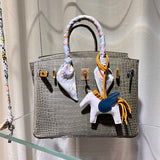 Side view of tailored structured handbag