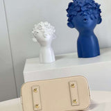 Styled lifestyle shot of statement elevated women's handbag – women's statement bag
