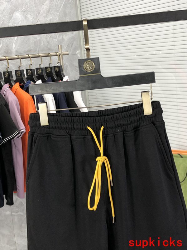 Close-up detail shot of Rhude luxury clothing with label-forward styling