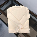 Close-up detail shot of Gucci luxury clothing with relaxed-fit cut
