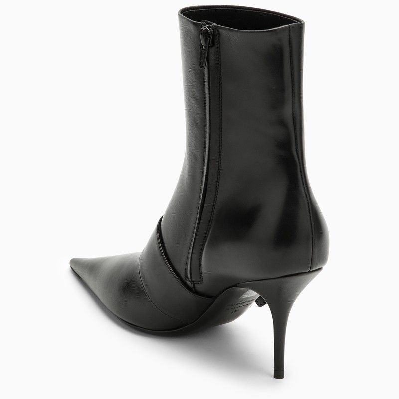 Close-up of Balenciaga boots hardware and fine stitching