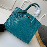 Front view of modern polished women's handbag – women's statement bag