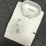 Close-up detail shot of Lacoste luxury clothing with logo-detail design