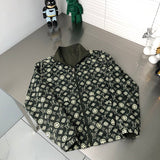 Side profile of Louis Vuitton luxury clothing with signature branding