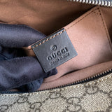 Close-up detail of structured polished women's handbag – women's statement bag