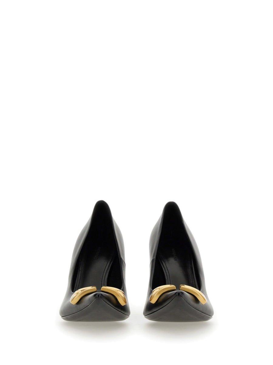 Close-up of Balenciaga pumps hardware and fine stitching