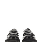 Close-up of Alexander McQueen slides hardware and fine stitching