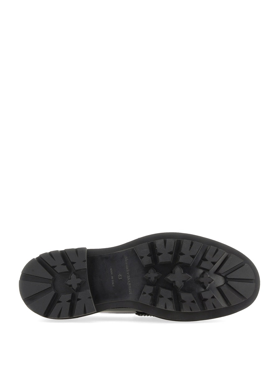 Alexander McQueen slides lifestyle shot premium designer piece