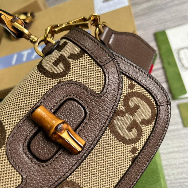 Back view of structured signature women's handbag – women's statement bag