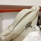 Side view of modern structured handbag