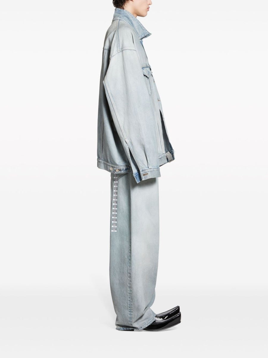 Close-up of Balenciaga outerwear hardware and fine stitching