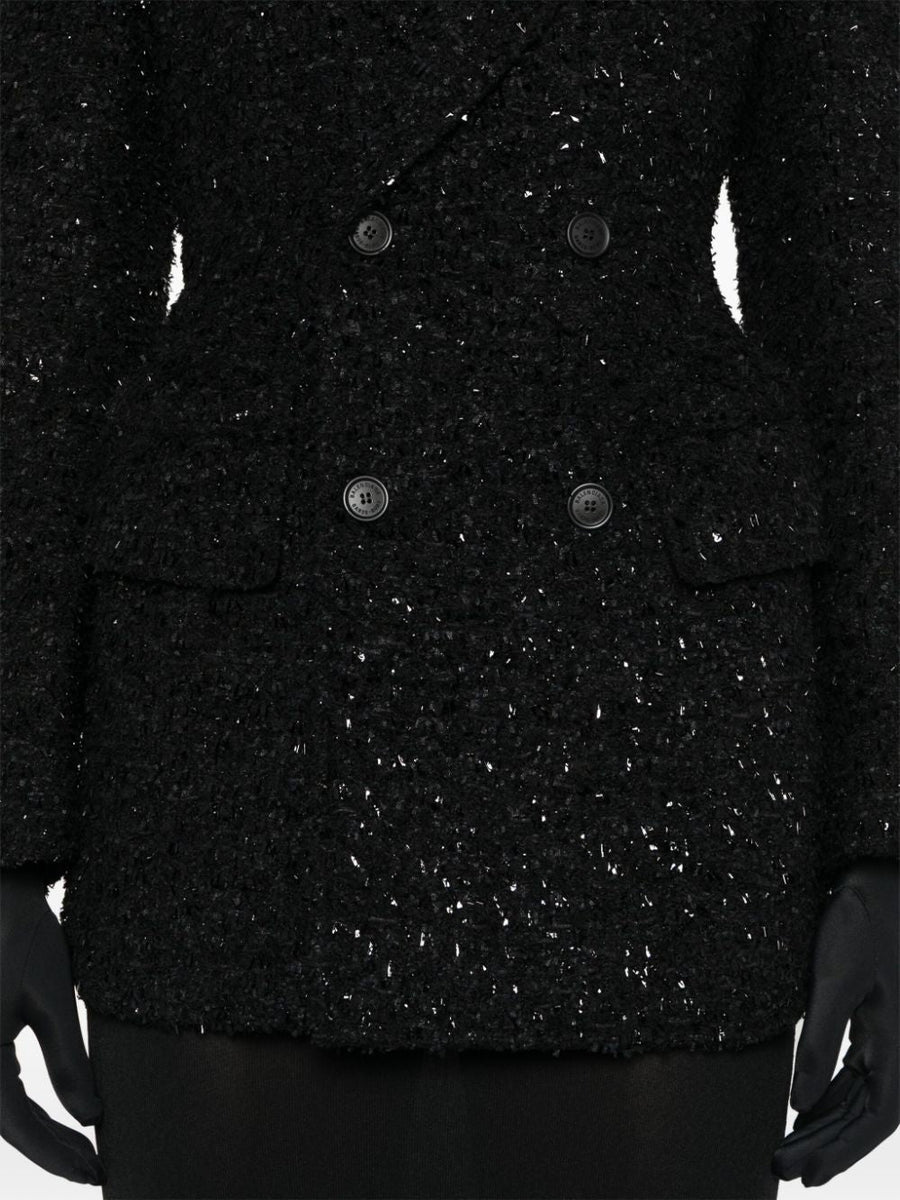 Close-up of Balenciaga outerwear hardware and fine stitching