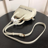 Styled lifestyle shot of refined structured women's handbag – women's everyday handbag