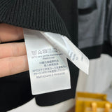 Close-up detail shot of Louis Vuitton luxury clothing with monogram-inspired silhouette