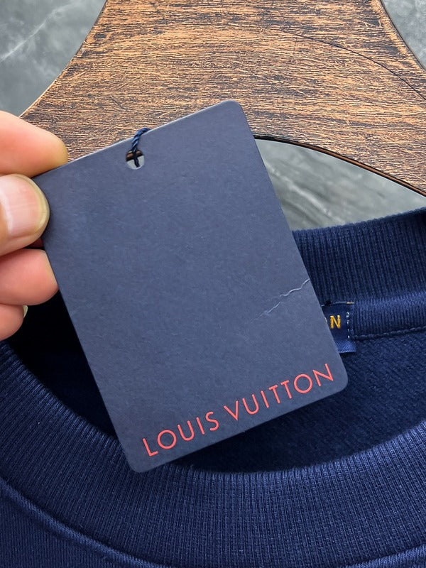 Close-up detail shot of Louis Vuitton luxury clothing with tailored silhouette