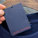 Close-up detail shot of Louis Vuitton luxury clothing with tailored silhouette
