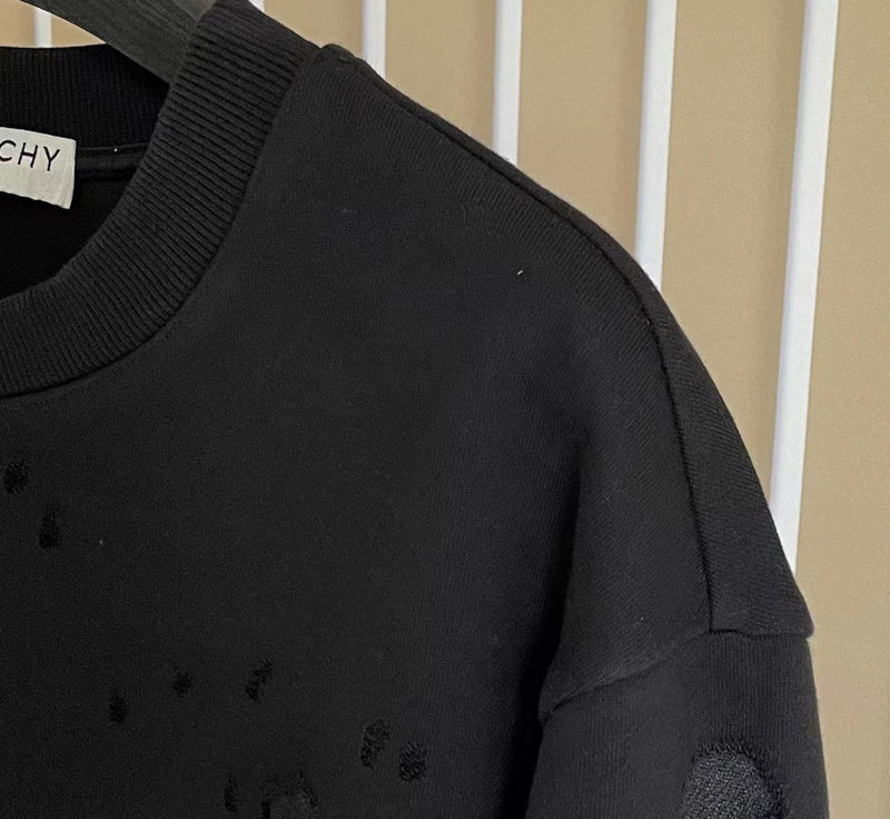 Flat lay presentation of Givenchy luxury clothing with logo-detail design
