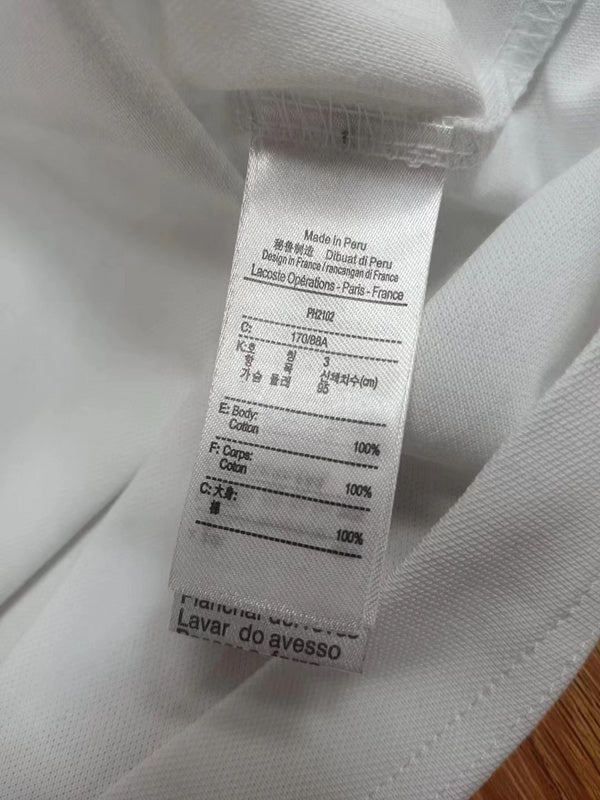 Close-up detail shot of Lacoste luxury clothing with tailored silhouette