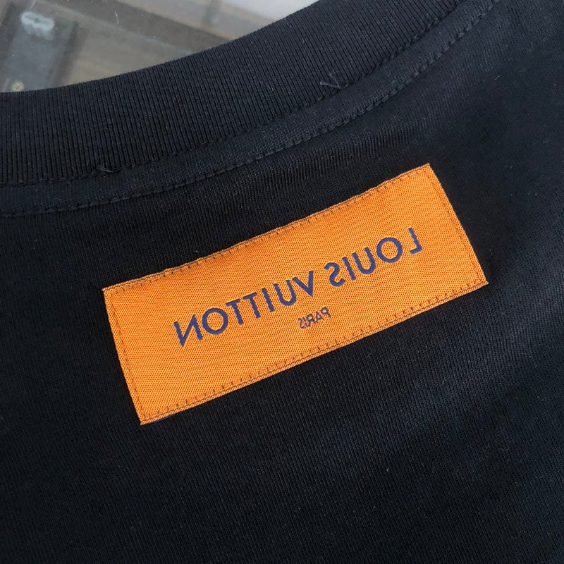 Close-up detail shot of Louis Vuitton cotton t-shirt with label-forward styling