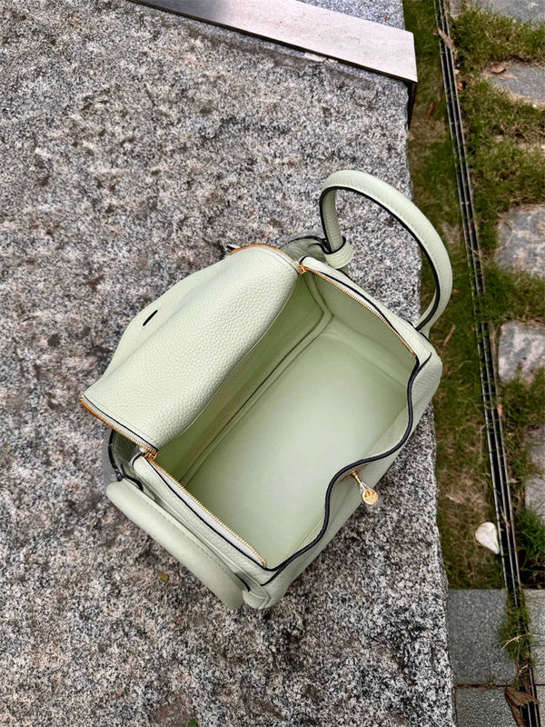 Side view of minimalist structured handbag