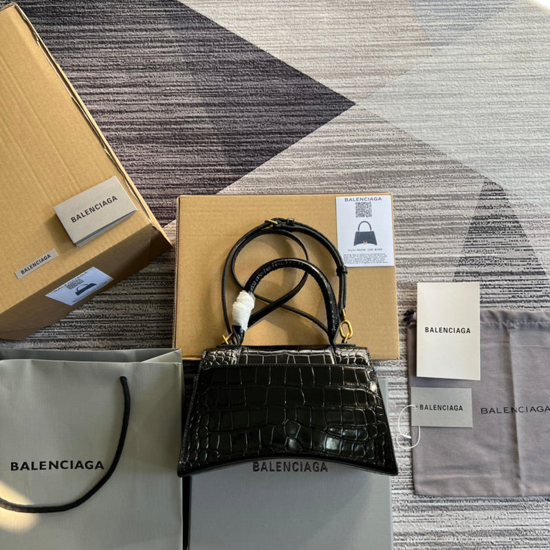 Styled lifestyle shot of everyday-luxe structured women's handbag – women's luxury accessory