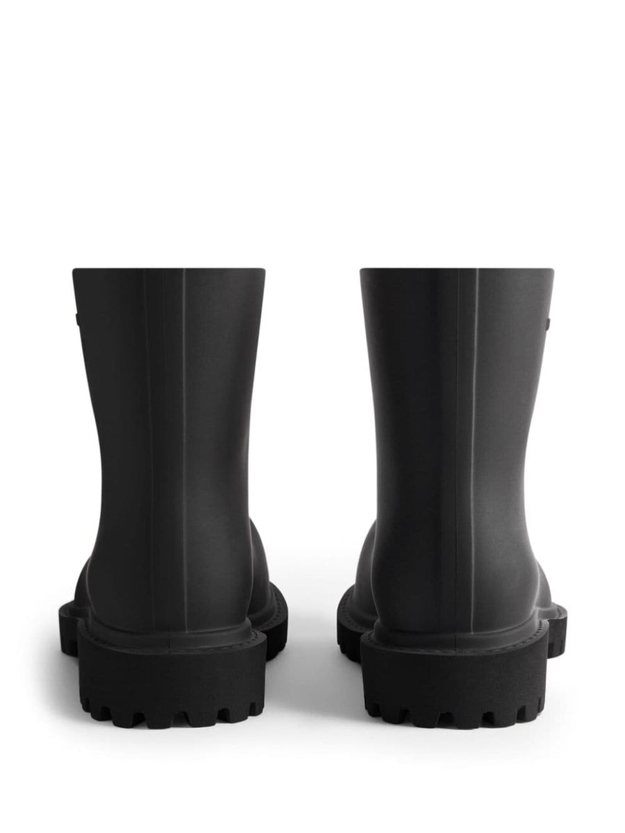 Close-up of Balenciaga boots hardware and fine stitching