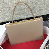 Handle and strap detail of refined modern women's handbag – women's designer-style accessory