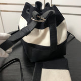Styled lifestyle shot of refined signature women's handbag – women's statement bag