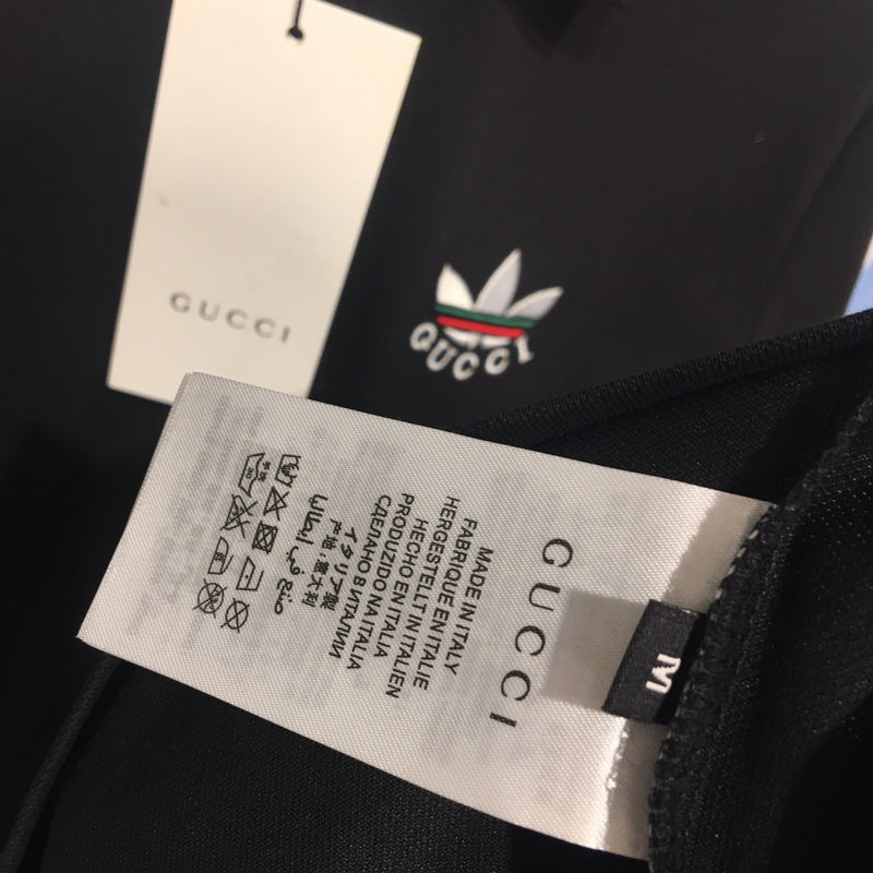 Close-up detail shot of Gucci luxury clothing with monogram-inspired silhouette