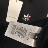 Close-up detail shot of Gucci luxury clothing with monogram-inspired silhouette