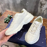 Gucci two-tone luxury sneakers view 7 signature lace-up style
