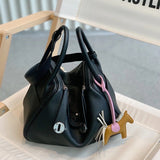  Timeless carryall bag carried on shoulder 16