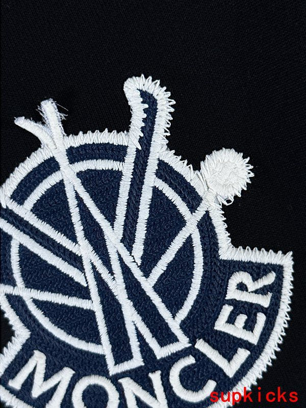 Front view of Moncler luxury clothing with signature branding