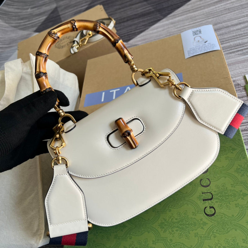 Back view of chic signature women's handbag – women's statement bag