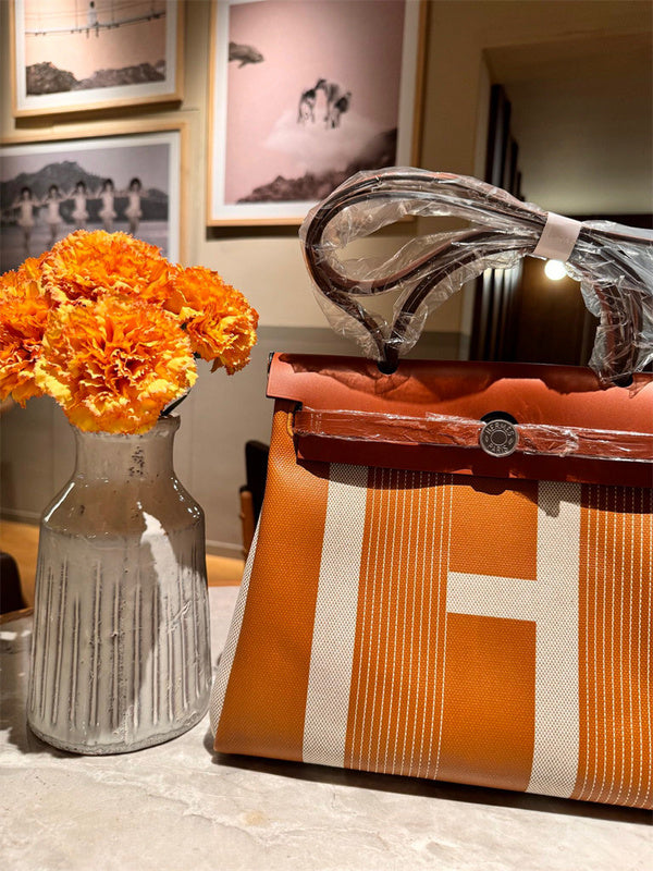  Clean-Lined handbag carried on shoulder 28