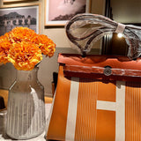  Clean-Lined handbag carried on shoulder 28