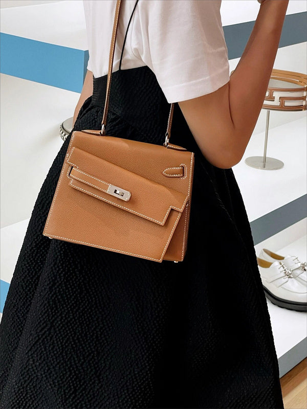 Side view of sculpted structured handbag