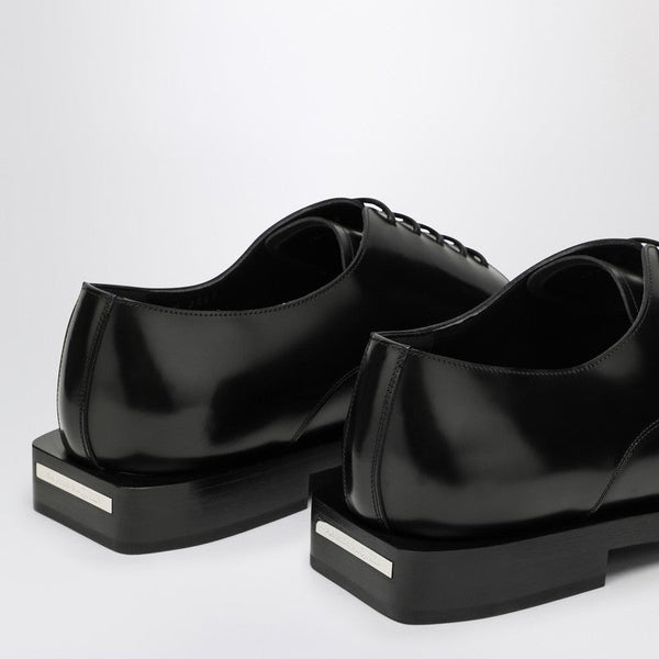 Close-up of Alexander McQueen flats hardware and fine stitching